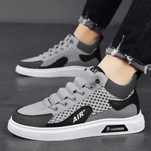 Sneaker alte traspiranti da uomo in mesh alla moda con design in grigio e nero
