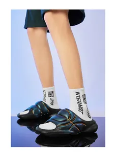 Detailed view of fluorescent sports slides with metallic finish and basketball pattern