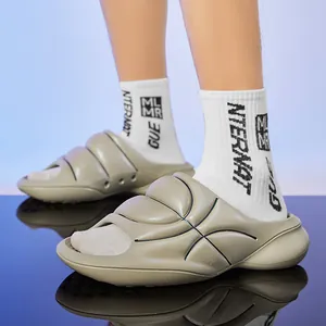 Stylish thick-soled sports slides with unique basketball-inspired texture design