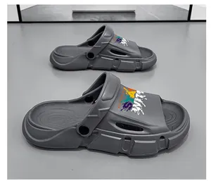 Close-up side view of grey outdoor summer beach sandals with vibrant graffiti design.