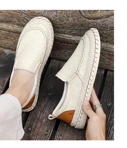 Detailed view of breathable beige linen loafers with handcrafted stitching and rope sole