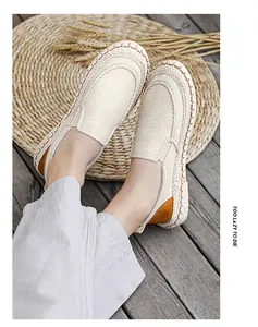 Close-up of breathable men's linen slip-on shoes with stylish braided sole detail.
