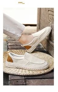 A detailed macro view of men's breathable beige linen loafers with elegant woven soles