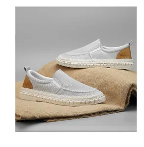 Side view of breathable grey canvas slip-on loafers for men on natural burlap backdrop