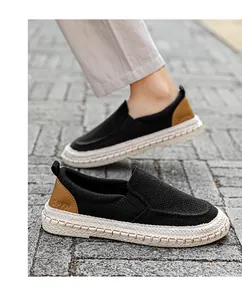Close-up detail of men's breathable black linen loafers featuring a comfortable slip-on style