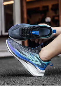 Detail shot of breathable blue and grey mesh running shoes with shock absorption sole