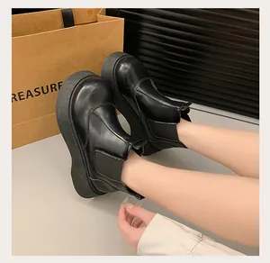 Classic black platform Chelsea boots for women with a stylish retro academy look