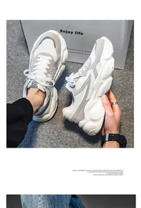 Detailed view of men's breathable white mesh chunky sneakers with retro platform soles