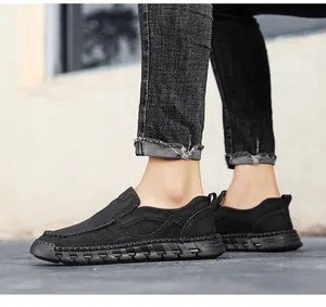 Detailed side view of black men's retro casual leather slip-on loafers with non-slip soles.