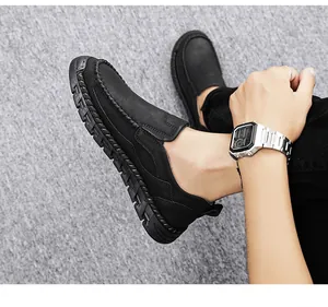 Detailed view of men's black retro leather slip-on loafers with durable non-slip sole