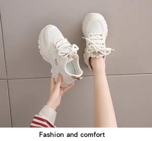 Detail view of stylish beige thick-sole dad shoes showing fabric texture and laces