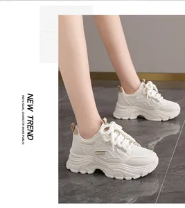 Stylish women's cream chunky platform sneakers shown in a casual lifestyle setting