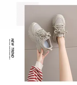 Detail view of beige chunky platform sneakers with breathable mesh and rope laces.