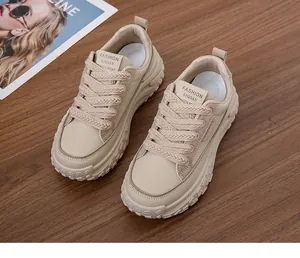 Detailed view of the beige thick-soled women's dad sneaker with retro textured design