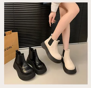 Fashionable women's mid-calf platform Chelsea boots in black and cream leather detail