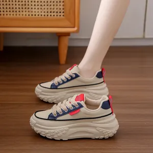 Vintage platform chunky sneakers for women, stylish beige casual shoes with navy accents.