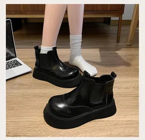 Detail view of black retro platform Martin boots for women in preppy style leather