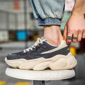 Breathable men's retro chunky dad sneakers with thick cream sole and grey mesh upper