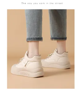 Close-up detail of cream platform puffy sneakers with thick soles and stylish design for women