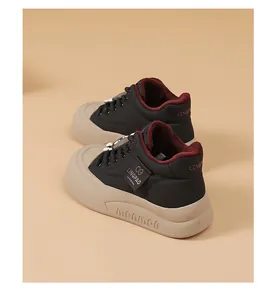 Back view of black chunky bread shoes with thick beige platform sole and burgundy lining