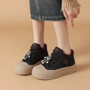 Stylish black ugly-cute platform bread shoes with cartoon charm accessories.