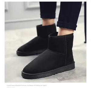 Close-up view of black suede short snow boots with thick anti-slip soles for men and women