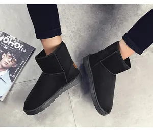 Detailed view of black suede men's snow boots featuring thick anti-slip rubber soles