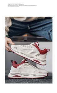 Close-up detail of retro chunky sneakers in white and red featuring a stylish thick sole