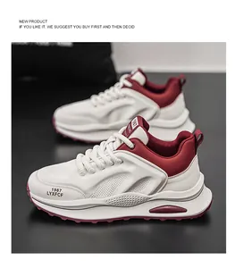 Detailed view of stylish retro men's chunky sneakers in white and burgundy with thick soles