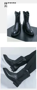 Detailed view of men's black cowboy boots with ostrich texture and pointed toe.