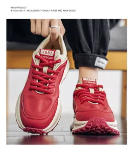 Detailed front view of stylish red and beige men's retro chunky sneakers with thick soles