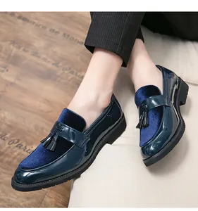 Close-up of men's navy blue patent leather loafers with stylish velvet and tassels