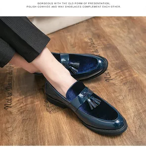 Detailed view of men's blue patent leather loafers with tassel and velvet finish
