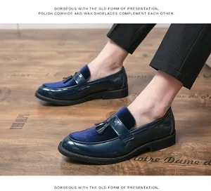 Close-up detail of men's navy blue patent leather loafers with velvet and elegant tassels