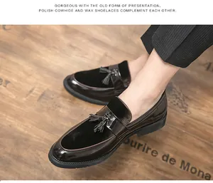 Close-up detail of men's tassel loafers in glossy patent leather and matte suede finish