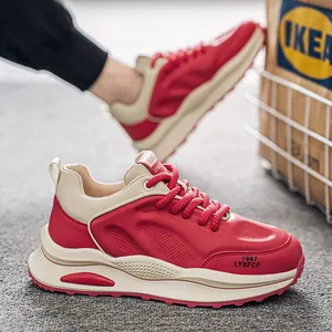 Trendy red and cream men's chunky retro sneakers featuring a breathable mesh design