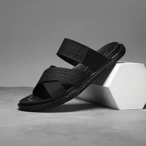 Detailed side view of black breathable men's outdoor sandals on a white prop