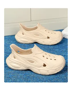 Detailed view of beige men's thick-sole garden clogs with breathable hollow-out design