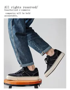 Side view detail of black men's low-top canvas sneakers with thick white soles