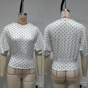 Close-up front and back views of a French style polka dot batwing sleeve cropped top