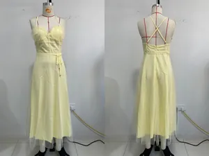 Detailed front and back views of a yellow spaghetti strap midi dress with mesh overlay
