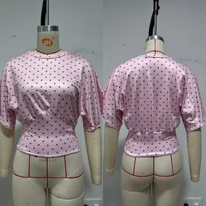 Detailed front and back views of a pink retro polka dot batwing sleeve waist short top