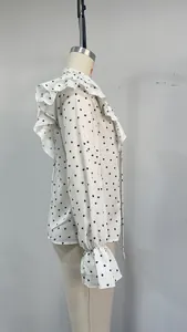 Side view showing ruffled shoulders and heart polka dots on this French blouse