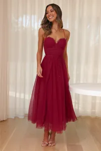 Detailed view of elegant burgundy tulle midi dress featuring corset bodice fashion