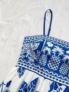 Close-up of blue and white tropical pineapple print camisole dress for summer vacation style