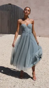 Elegant dusty blue spaghetti strap midi dress with tulle skirt for vacation style