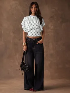 Elegant retro French polka dot batwing sleeve cropped top paired with dark wide-leg jeans