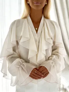Detailed view of elegant white chiffon blouse with layered ruffles and flared sleeves