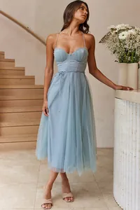 Full-length view of an elegant light blue corset midi dress with mesh skirt and straps.