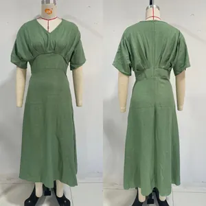Detail view of the front and back of a sage green V-neck midi dress with a cinched waistline